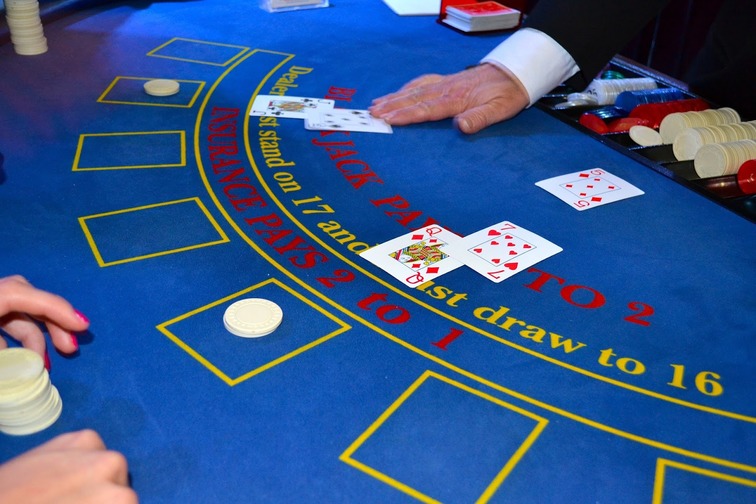 blackjack game table with cards placed on it