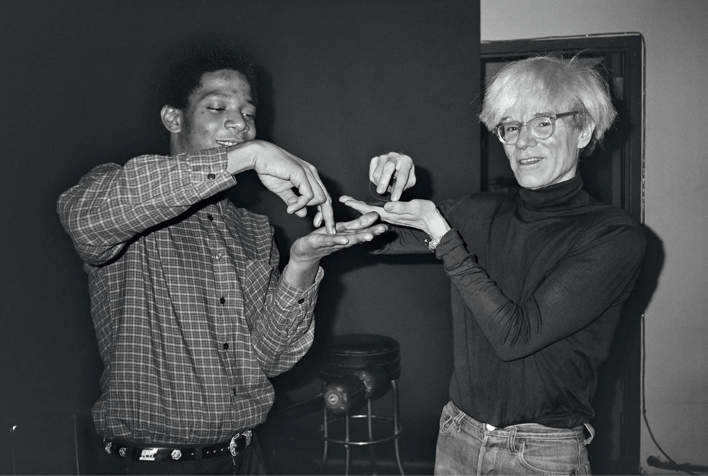 A photo of Jean-Michel Basquiat with Andy Warhol