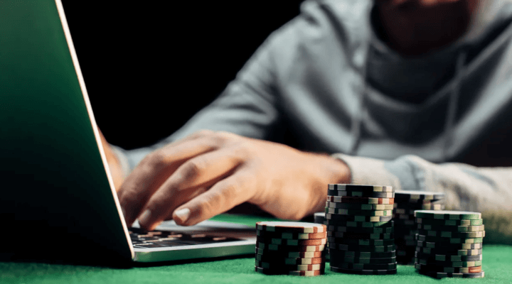 A person using their laptop to access a gambling site