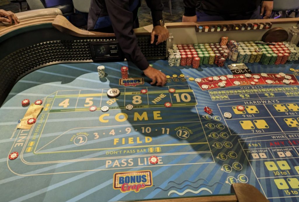 A craps table in a brick-and-mortar casino
