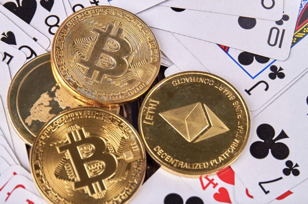 Crypto coins lying on playing cards 