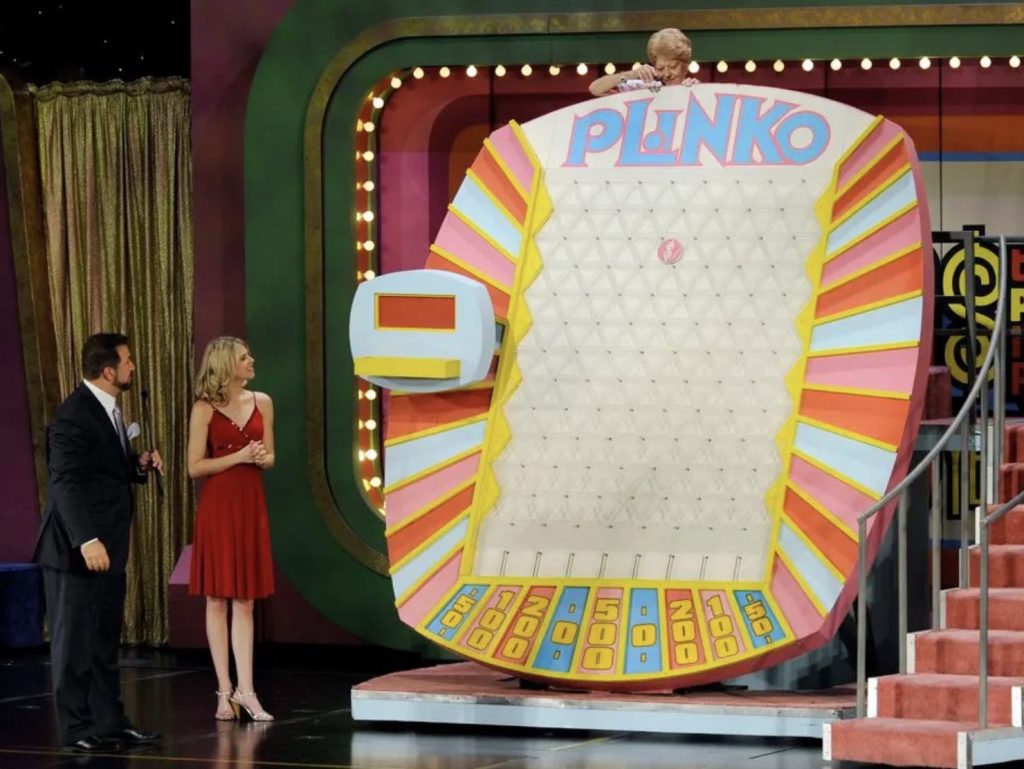 A Plinko studio; three dealers entertain their viewers